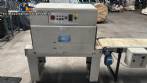 Automatic L-sealer with shrink tunnel.
