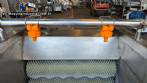 Washer and peeler for fresh fruits, vegetables, and tubers with abrasive brush roller.