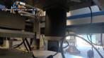 Automatic self-adhesive labeling machine for cylindrical bottles