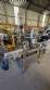 Automatic self-adhesive labeling machine for cylindrical bottles