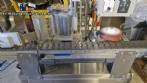 Automatic self-adhesive labeling machine for cylindrical bottles