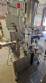 Automatic self-adhesive labeling machine for cylindrical bottles