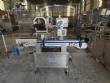 Automatic self-adhesive labeling machine for cylindrical bottles