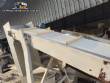 Inclined conveyor belt with talisca