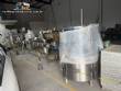 Milainox automatic rotary filling, dosing, and sealing machine for cups, pots, and jars.