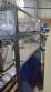 Pick and place product feeder for flowpack transfer cartoning machine