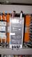 Pick and place product feeder for flowpack transfer cartoning machine