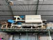 Automatic baling machine with shrink tunnel for bottles and jars in bales.