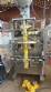 Vertical automatic packaging machine for ARV powders