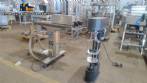 Filling machine with 2 nozzles for liquids and pilfer cap screwer