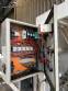 Automatic baling machine with shrink tunnel for bottles and jars in bales.