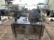 Packaging line with IMSB bung capper, Maqmundi labeler and accumulator table