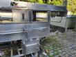 Filling line for 10 and 20 liter gallon jugs with filling machine and rinser/washer.