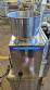 Dosing and packaging machine for granular and powdered products