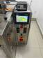 Automatic volumetric dosing packaging machine for powder products.