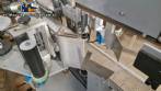 Automatic double-head labeling machine for cylindrical and flat bottles, Tudela, 3,000 labels per hour.