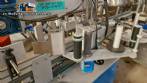 Automatic double-head labeling machine for cylindrical and flat bottles, Tudela, 3,000 labels per hour.