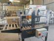 Adhesive tape case sealer with safety enclosure and door sensors Strapack