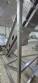 Inova Industrial inclined stainless steel conveyor belt with cleats.