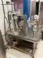 Stainless steel rotary sealer with aluminum seal for Delgo jars, cups and bottles.