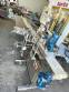 Labeling machine for dropper bottles with double printhead transparent stainless steel label