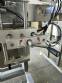 Labeling machine for dropper bottles with double printhead transparent stainless steel label