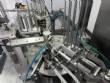 Automatic rotary filling, dosing, and sealing machine for communion cups and small cups.