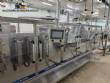 Horizontal stainless steel packaging machine for Profills stand-up pouch packaging.