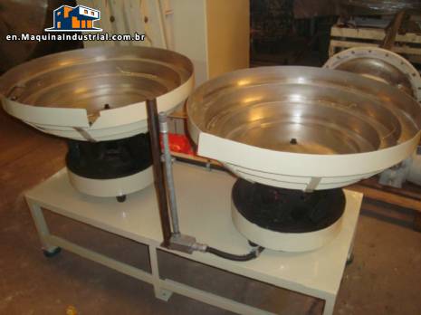 Positioner for vibratory feeder for double time