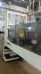 Labeling machine with steam sleeve tunnel and bottle baler