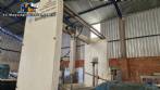 Labeling machine with steam sleeve tunnel and bottle baler