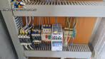 Labeling machine with steam sleeve tunnel and bottle baler