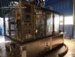 Zegla rotary filling machine with rinser and three-block capping system.