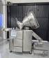 Handtmann vacuum stuffer with twister and tilting elevator, up to 6,000 kg per hour.